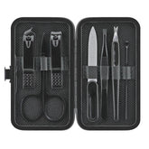 The compact black manicure set features eight grooming tools stored in a sleek case, including scissors, nail clippers, a file, and tweezers, all neatly organized for easy access.