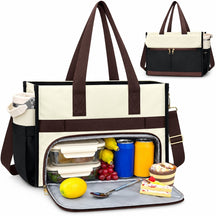 Spacious black and white insulated lunch bag with brown straps, showcasing a leak-proof cooler compartment filled with lunch items like fruit, drinks, and dessert. The bag includes a removable storage container and a spoon, making it ideal for on-the-go meals.