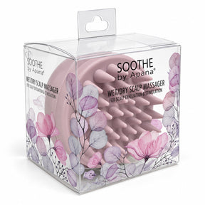 Pink scalp massager featuring soft, rounded bristles housed in a transparent box adorned with floral designs. The packaging highlights the product name and its purpose for scalp exfoliation and stimulation.
