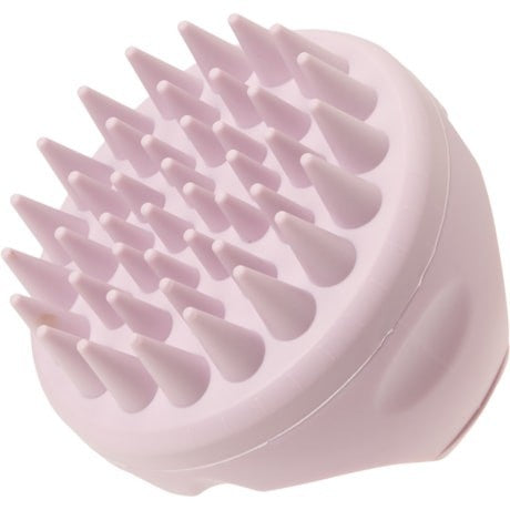 The scalp massager features a rounded design with multiple soft, pointed bristles arranged on top, all in a light lavender color for gentle stimulation. The ergonomic shape allows for comfortable handling during use.