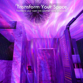 Vibrant purple and pink light patterns projected onto a ceiling and walls, creating a dreamy, cosmic atmosphere, with star-like dots scattered throughout. A modern lighting fixture is visible above, enhancing the decor of the space.